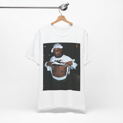 A black graphic t-shirt featuring a graphic of Tupac Shakur (2Pac).