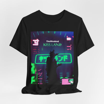 A black graphic t-shirt featuring a graphic related to The Weeknd's 'Kiss Land' live performances.