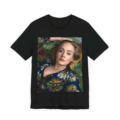 A black graphic t-shirt featuring a photo of Adele, possibly with floral elements or a floral background, showing a serene or contemplative expression.