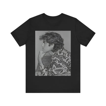 A black graphic t-shirt featuring a graphic of George Michael from his 80s Wham! era.