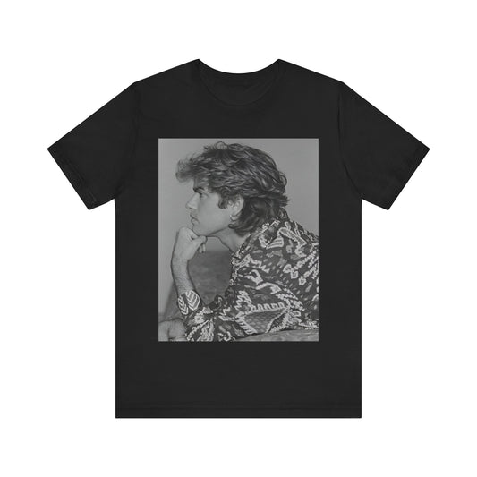 A black graphic t-shirt featuring a graphic of George Michael from his 80s Wham! era.