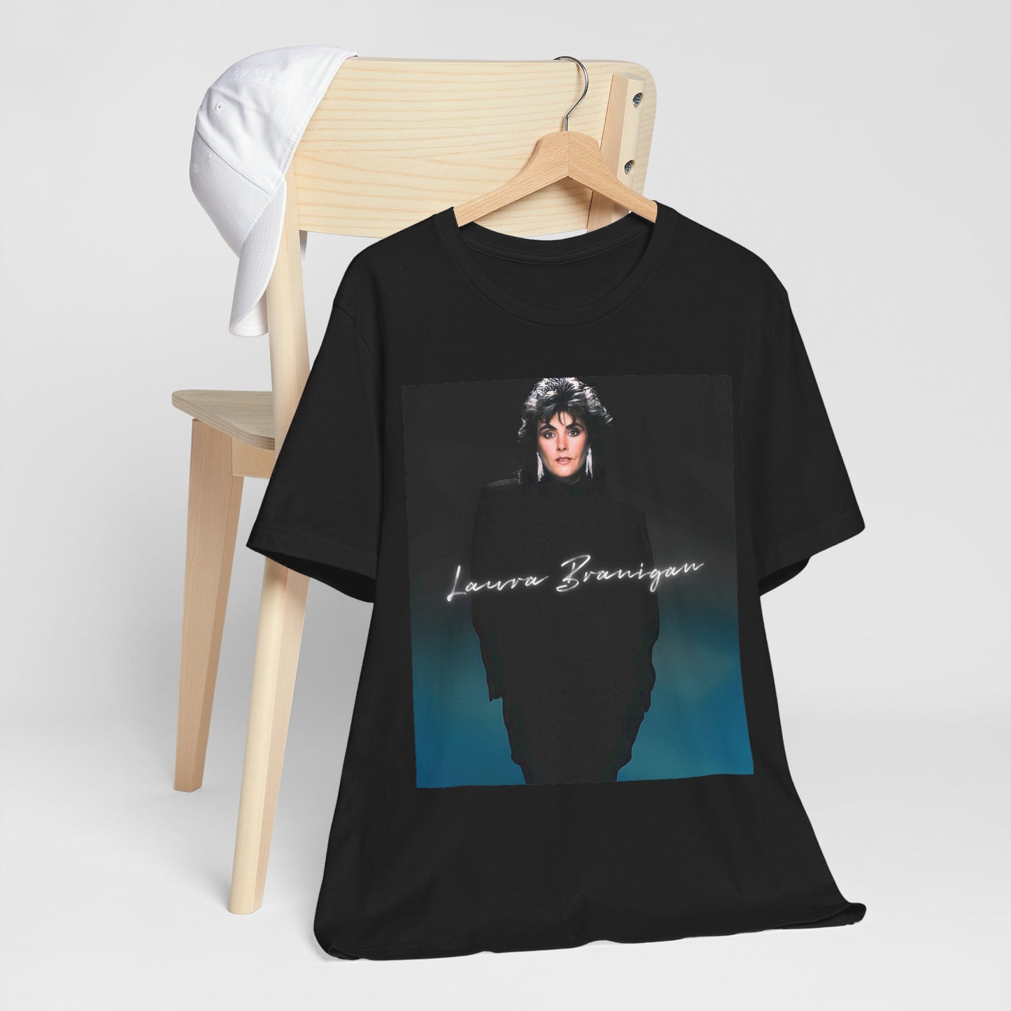 A black graphic t-shirt featuring a graphic of Laura Branigan as an 80s power ballad vocalist.