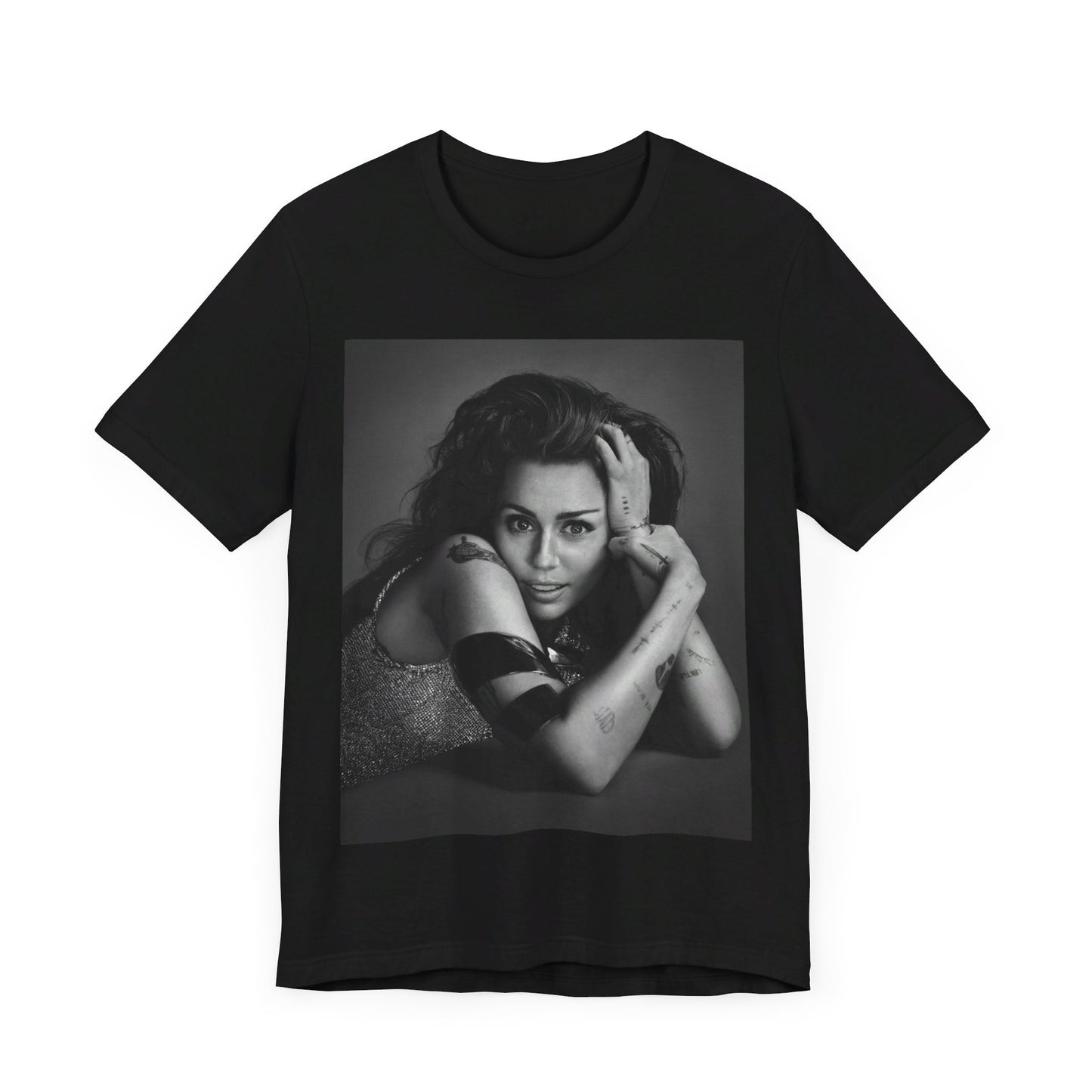 A black graphic t-shirt featuring a black and white portrait graphic of Miley Cyrus.