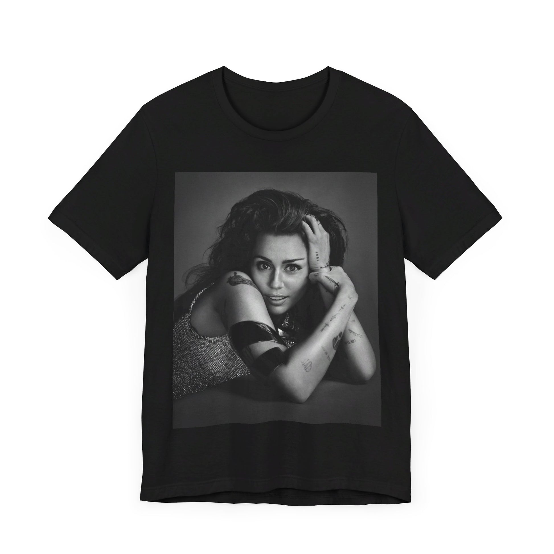 A black graphic t-shirt featuring a black and white portrait graphic of Miley Cyrus.