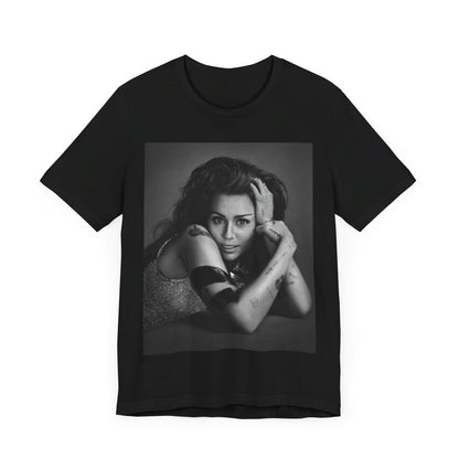 A black graphic t-shirt featuring a black and white portrait graphic of Miley Cyrus.