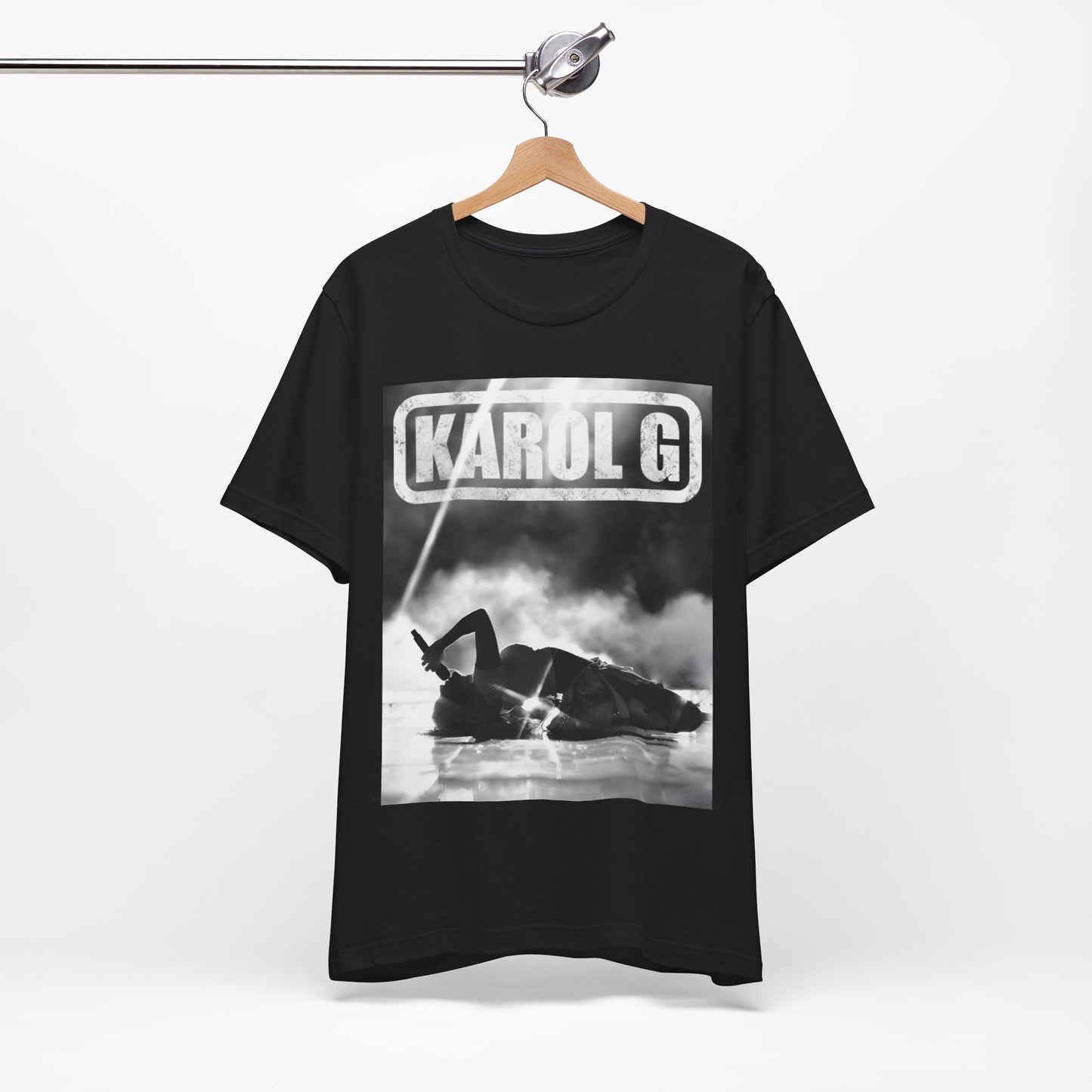 A black graphic t-shirt featuring a black and white graphic or photo of Karol G performing live on stage.