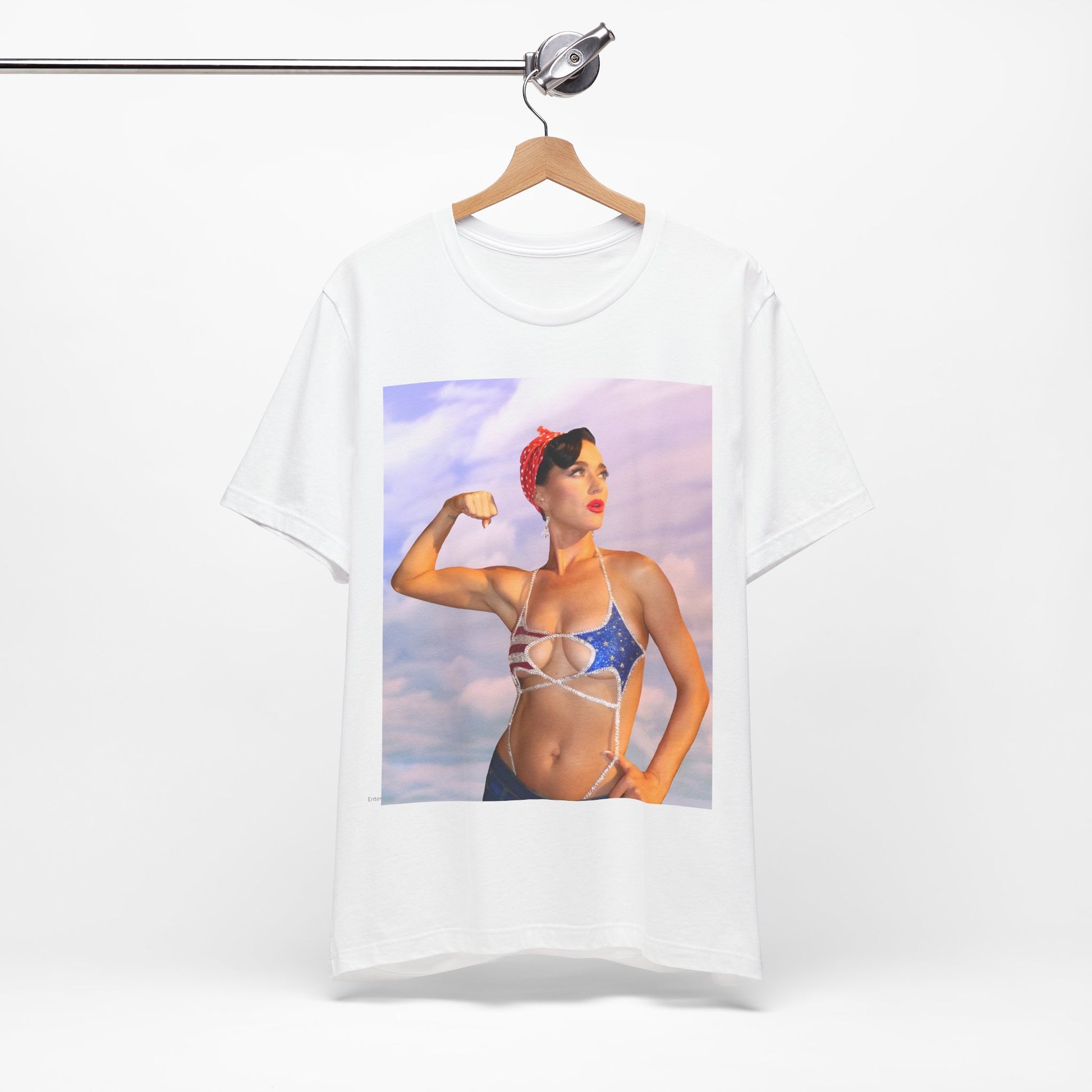 A black graphic t-shirt featuring a bold graphic of Katy Perry as a pop superstar.
