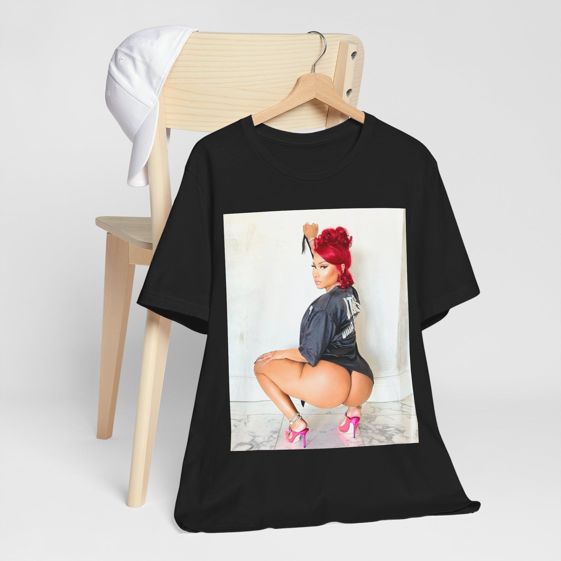 A black graphic t-shirt featuring a graphic of Nicki Minaj in an iconic power pose.