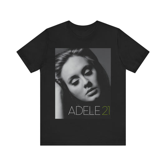 A black graphic t-shirt featuring the album cover art for Adele's '21' album, showing a close-up portrait of her with a contemplative expression.