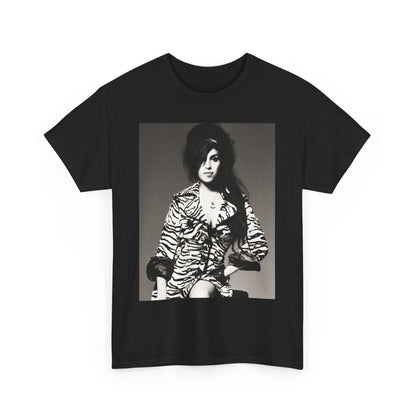 A black graphic t-shirt featuring a vintage black and white portrait of Amy Winehouse, showing her with her signature beehive and soulful expression.
