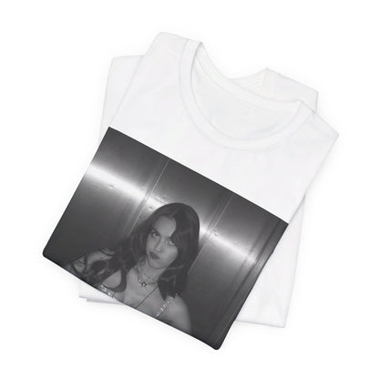 A black graphic t-shirt featuring a black and white portrait photo of Olivia Rodrigo.
