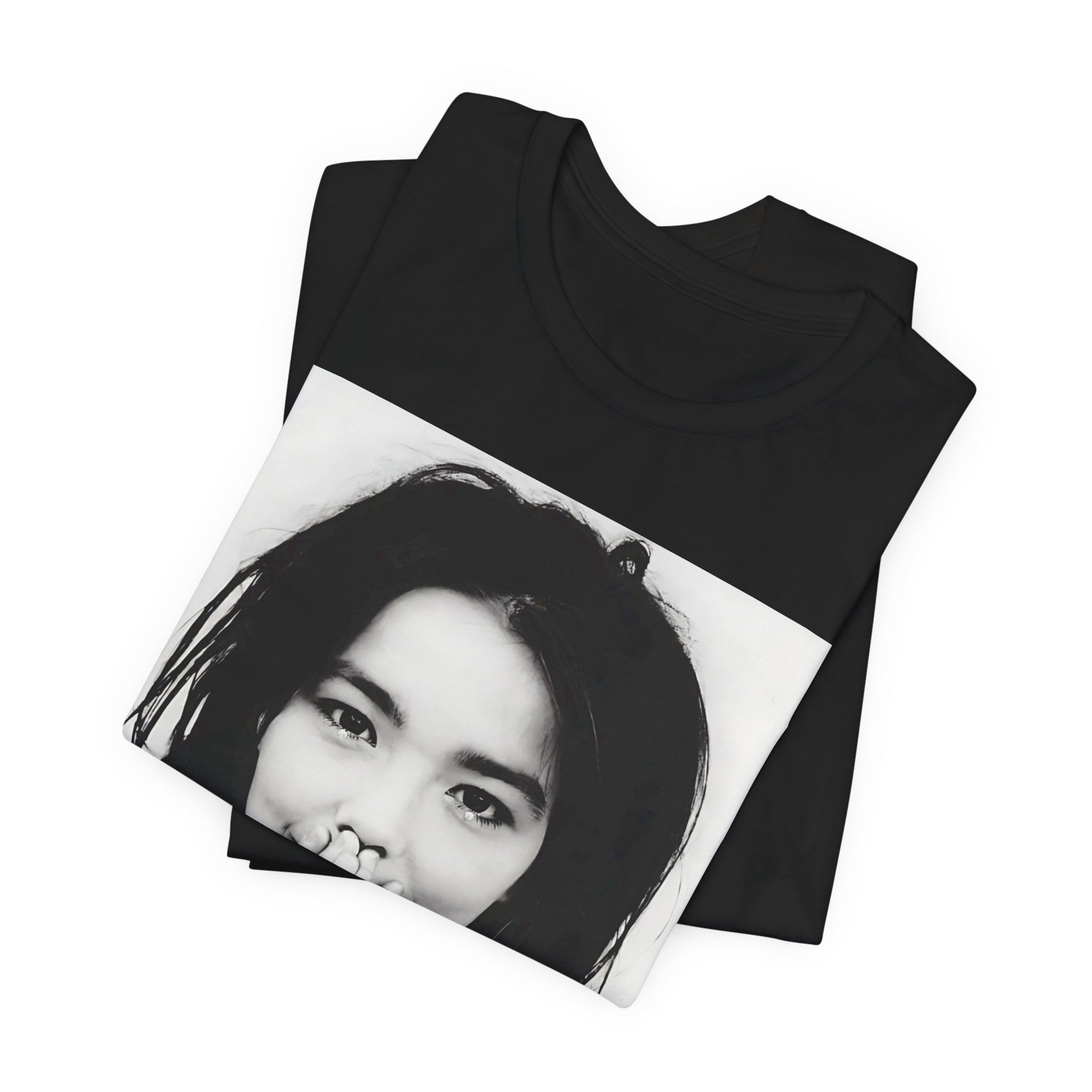 A black graphic t-shirt featuring a 90s black and white photographic portrait of Bjork.