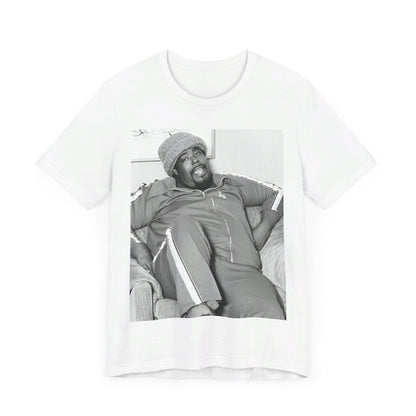 A black graphic t-shirt featuring a 70s-style portrait photo of Barry White in a lounge setting.