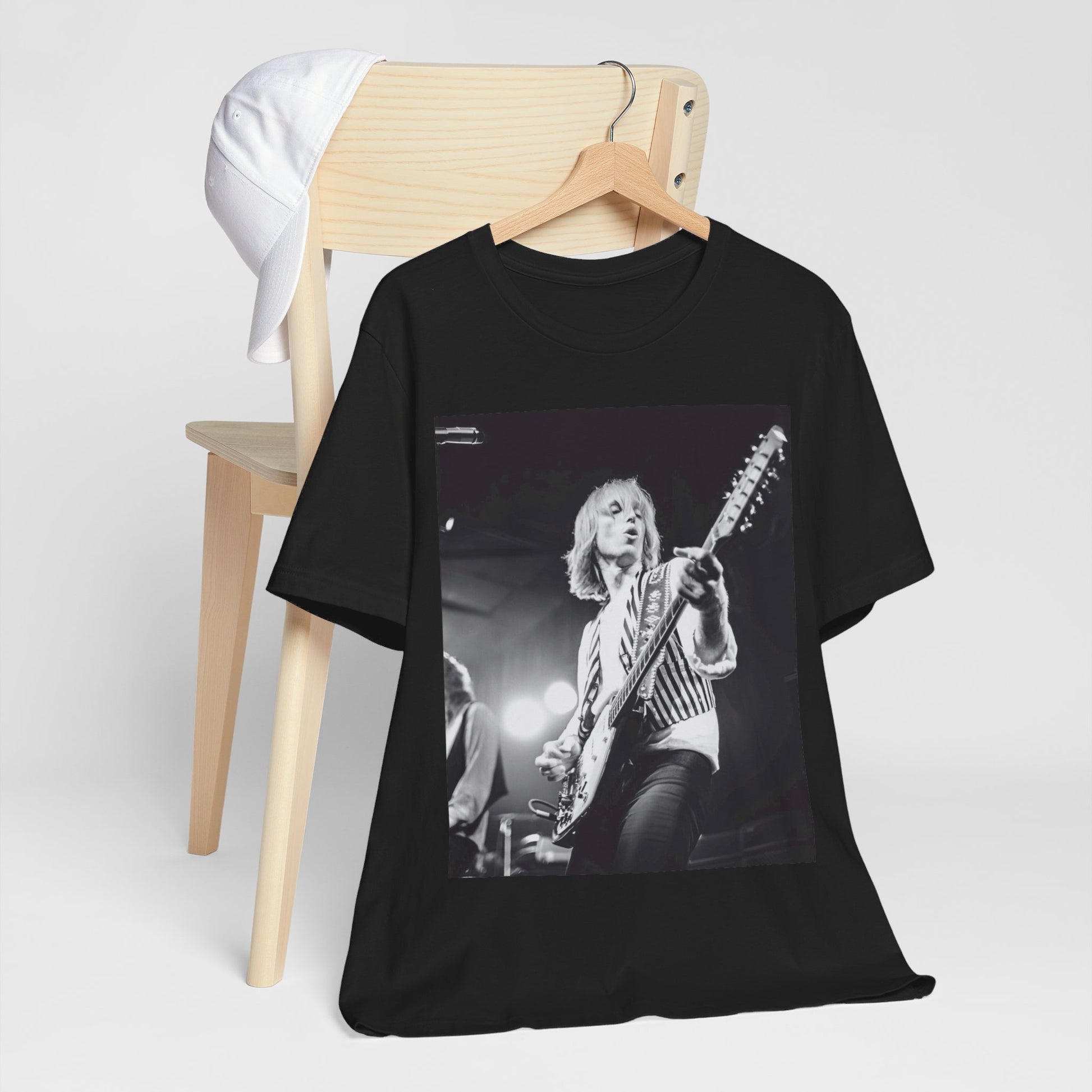 A black graphic t-shirt featuring a graphic of Tom Petty as a Rock & Roll Hall of Fame icon.