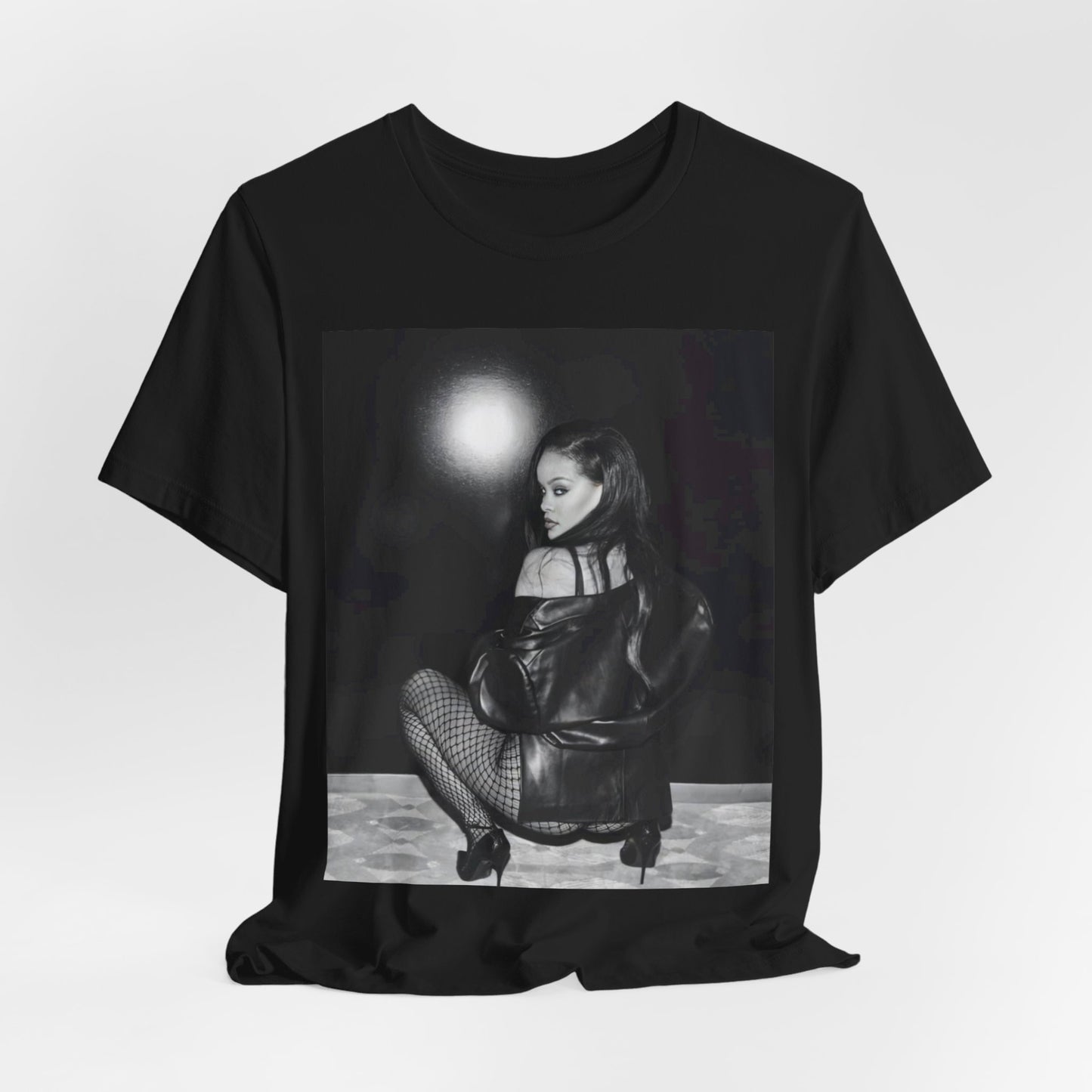 A black graphic t-shirt featuring a black and white sexy graphic of Rihanna.