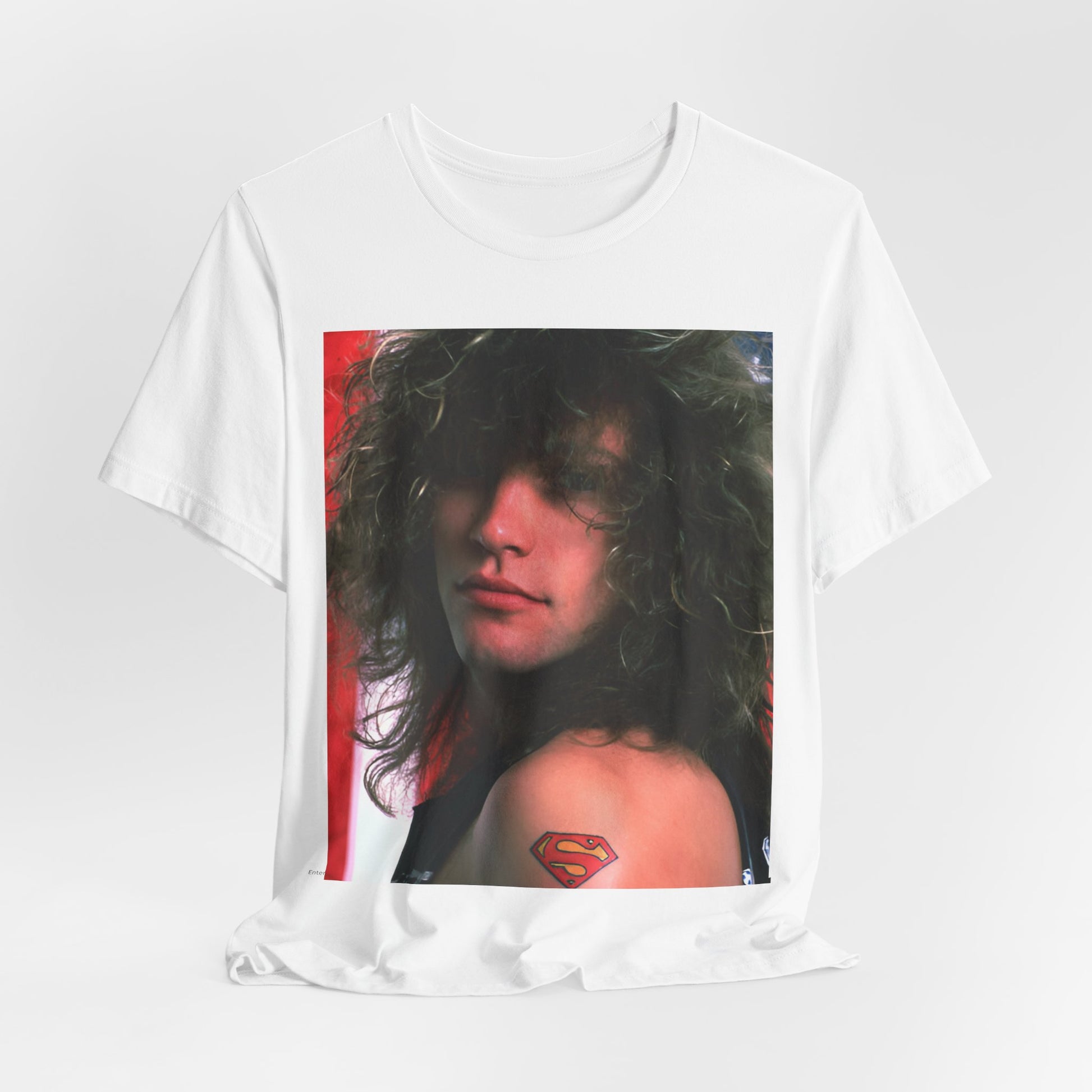 A black graphic t-shirt featuring a graphic of Bon Jovi, possibly with a Superman logo or a tattoo-inspired design.