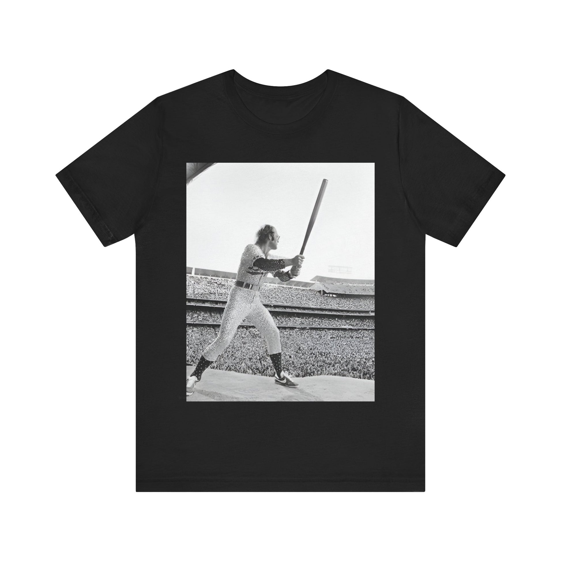 A black graphic t-shirt featuring a black and white graphic or photo related to Elton John's 1975 tour in America.