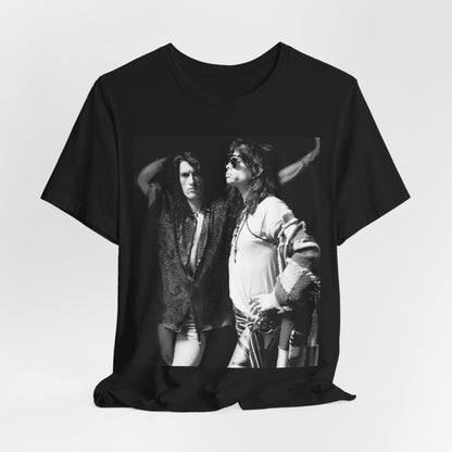 A black graphic t-shirt featuring a dynamic photo or illustration of Aerosmith's Steven Tyler and Joe Perry performing together on stage, highlighting their synergy.