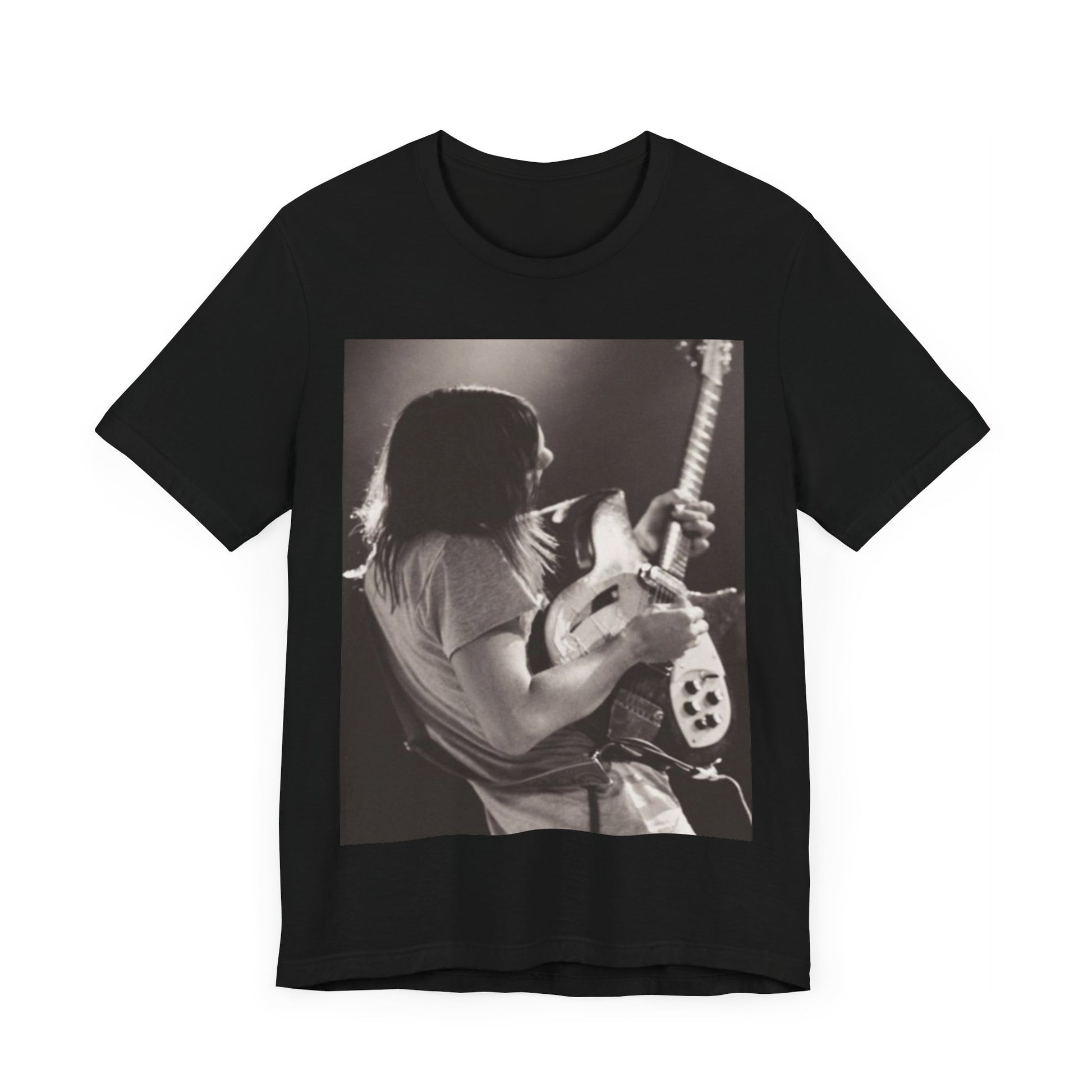 A black graphic t-shirt featuring a black and white graphic or photo of Tame Impala performing live on stage.
