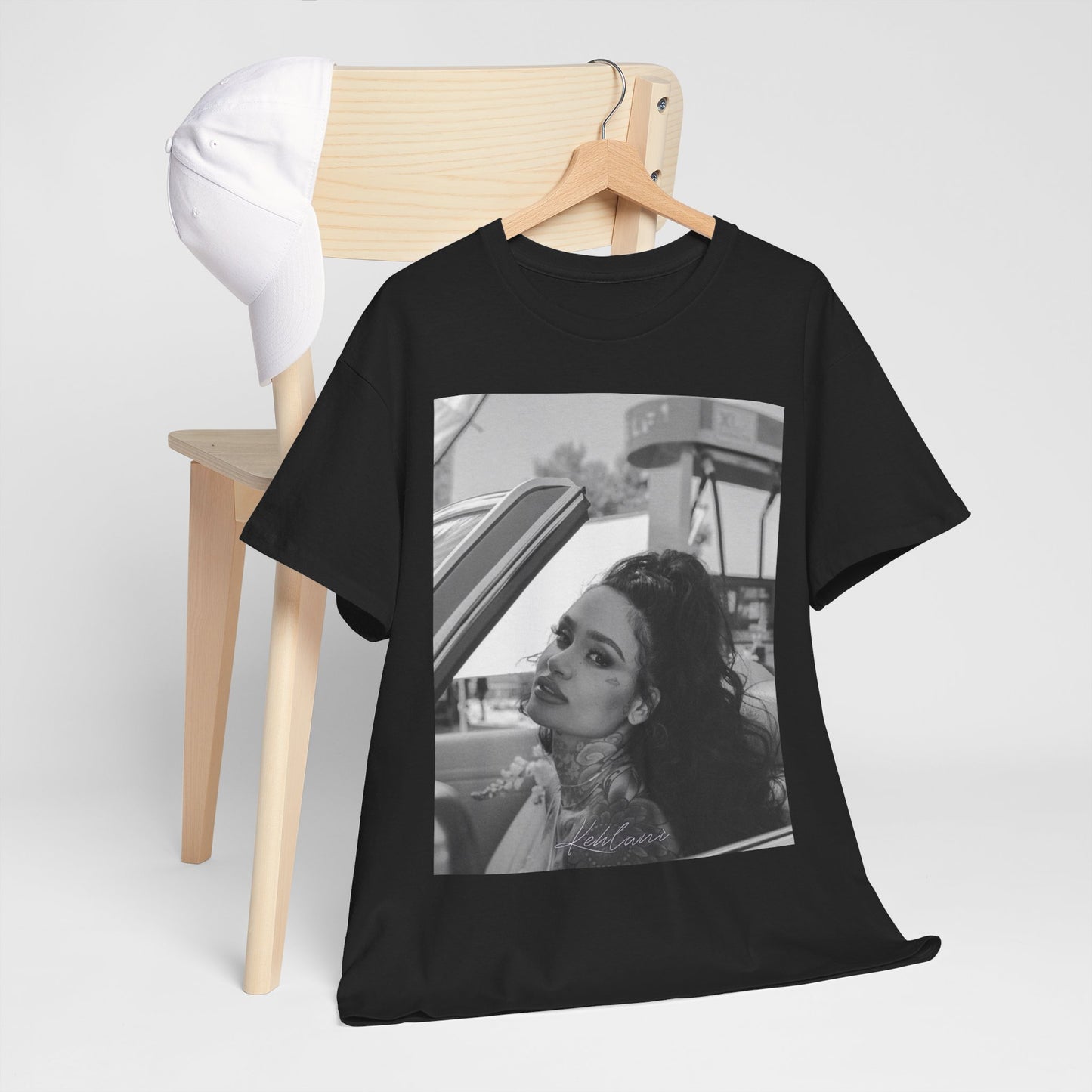 A black graphic t-shirt featuring a black and white retro photo or graphic of Kehlani.