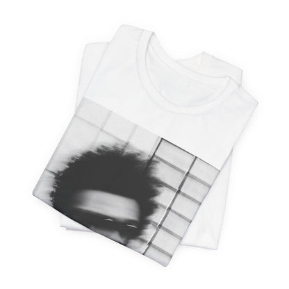 A black graphic t-shirt featuring a blurred graphic of The Weeknd from his 'After Hours' era.