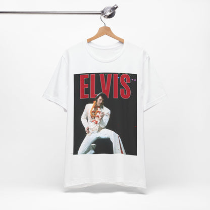 A black graphic t-shirt featuring a glamorous graphic or photo of Elvis Presley on a Las Vegas stage.