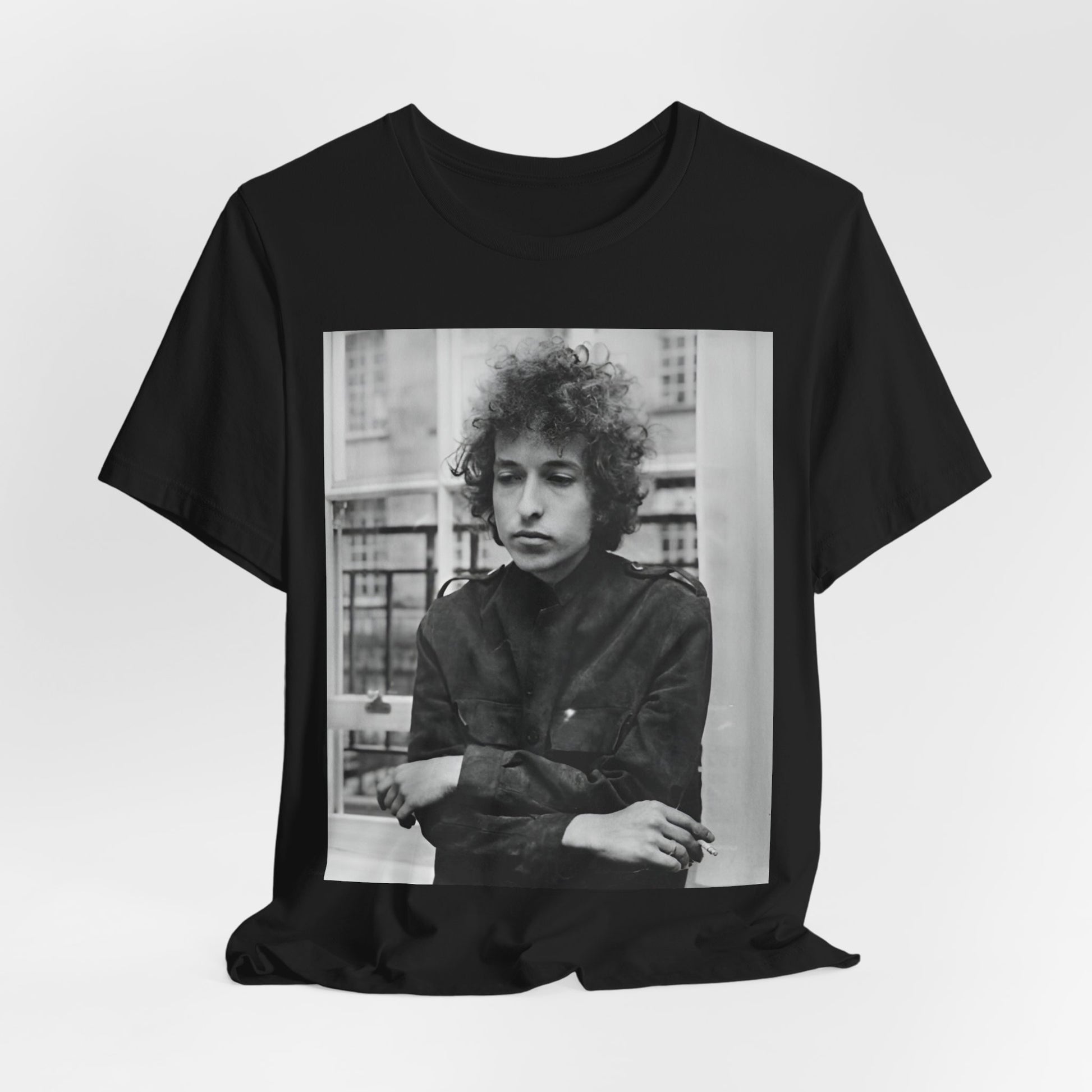 A black graphic t-shirt featuring a black and white graphic of Bob Dylan from the folk revival era.