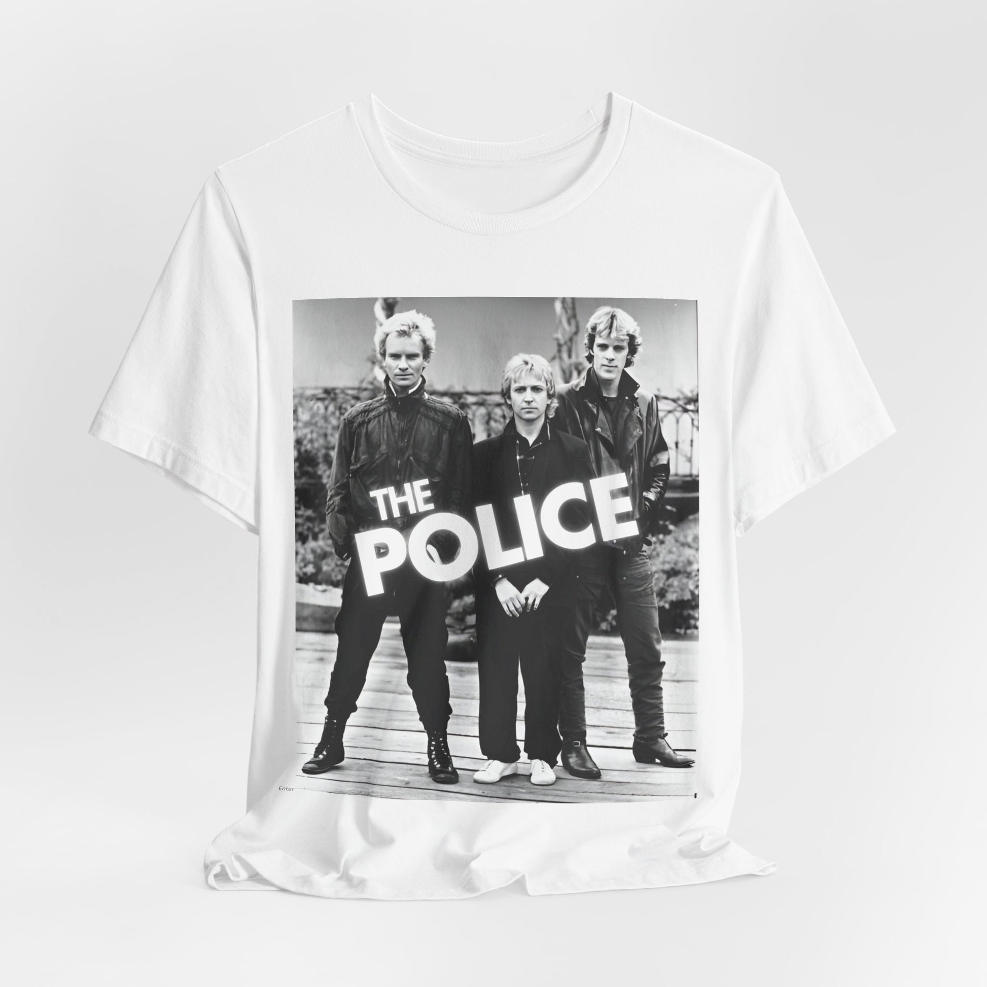 A black graphic t-shirt featuring an 80s pop rock aesthetic black and white graphic of The Police.