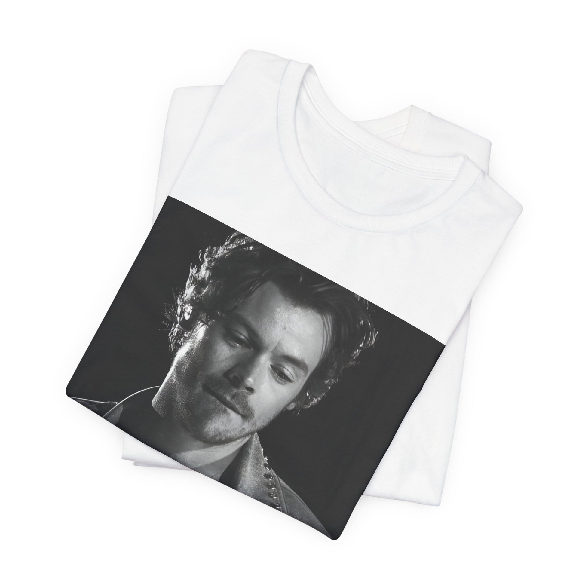 A black graphic t-shirt featuring a black and white graphic inspired by Harry Styles' tattoos.