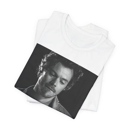 A black graphic t-shirt featuring a black and white graphic inspired by Harry Styles' tattoos.