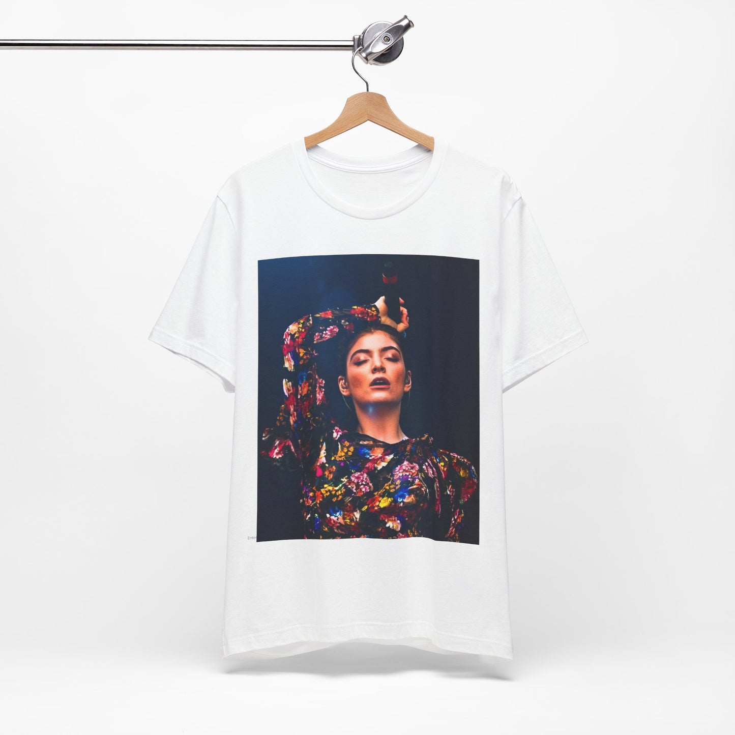 A black graphic t-shirt featuring a retro graphic related to Lorde's 'Pure Heroine' album era.