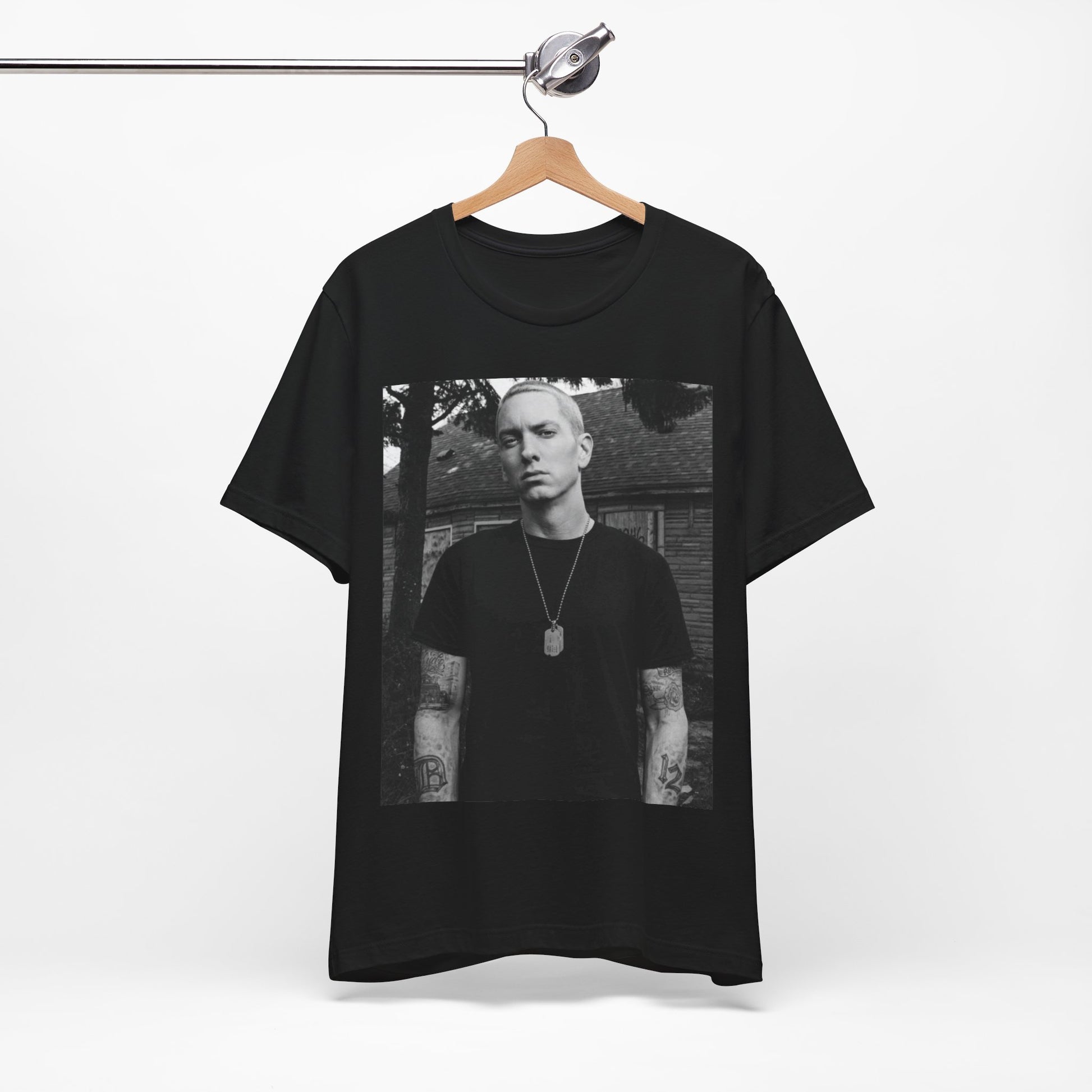 A black graphic t-shirt featuring a black and white graphic of Eminem as Slim Shady.