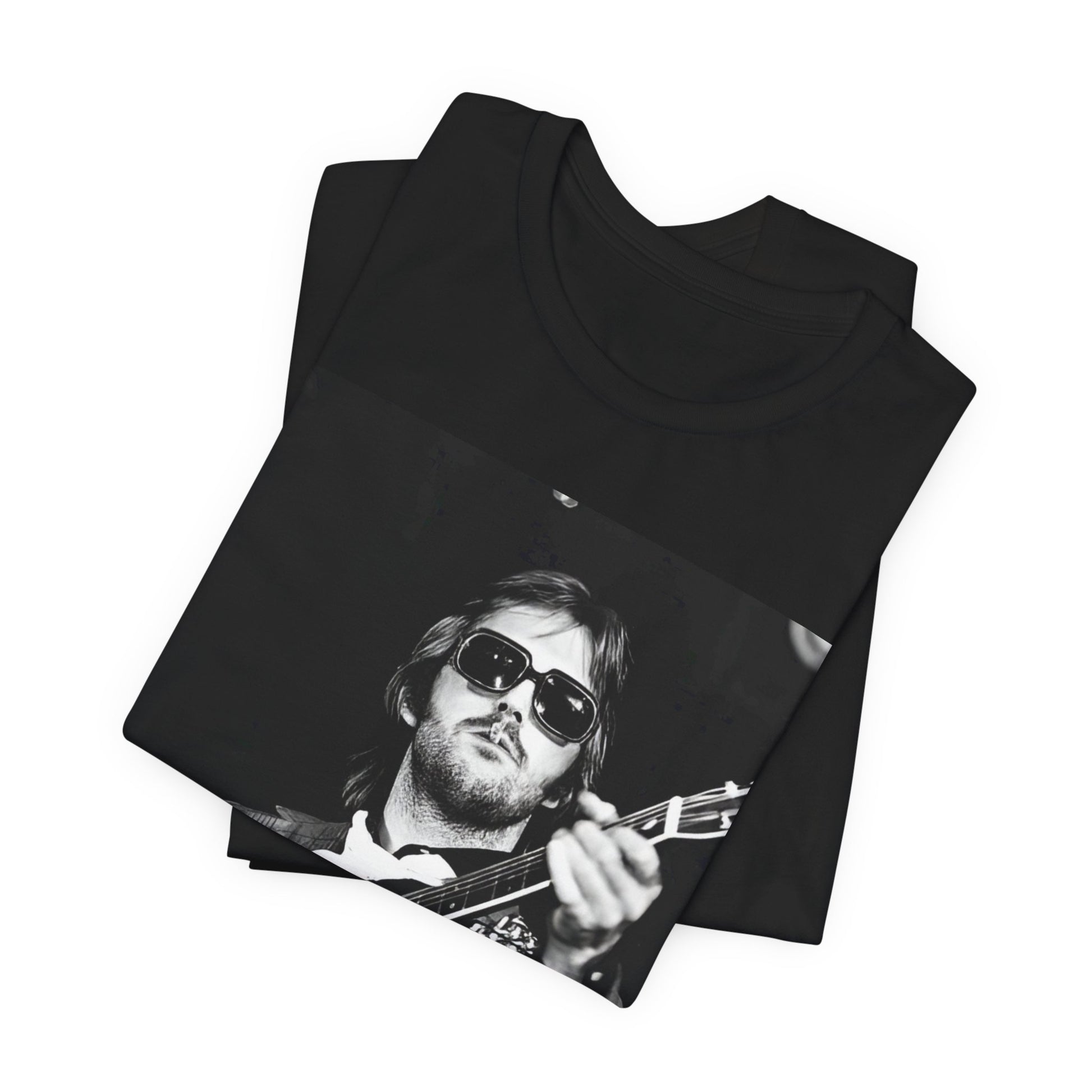 A black graphic t-shirt featuring a graphic of Eric Clapton with a chill blues rock vibe.