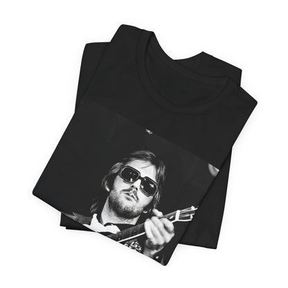 A black graphic t-shirt featuring a graphic of Eric Clapton with a chill blues rock vibe.