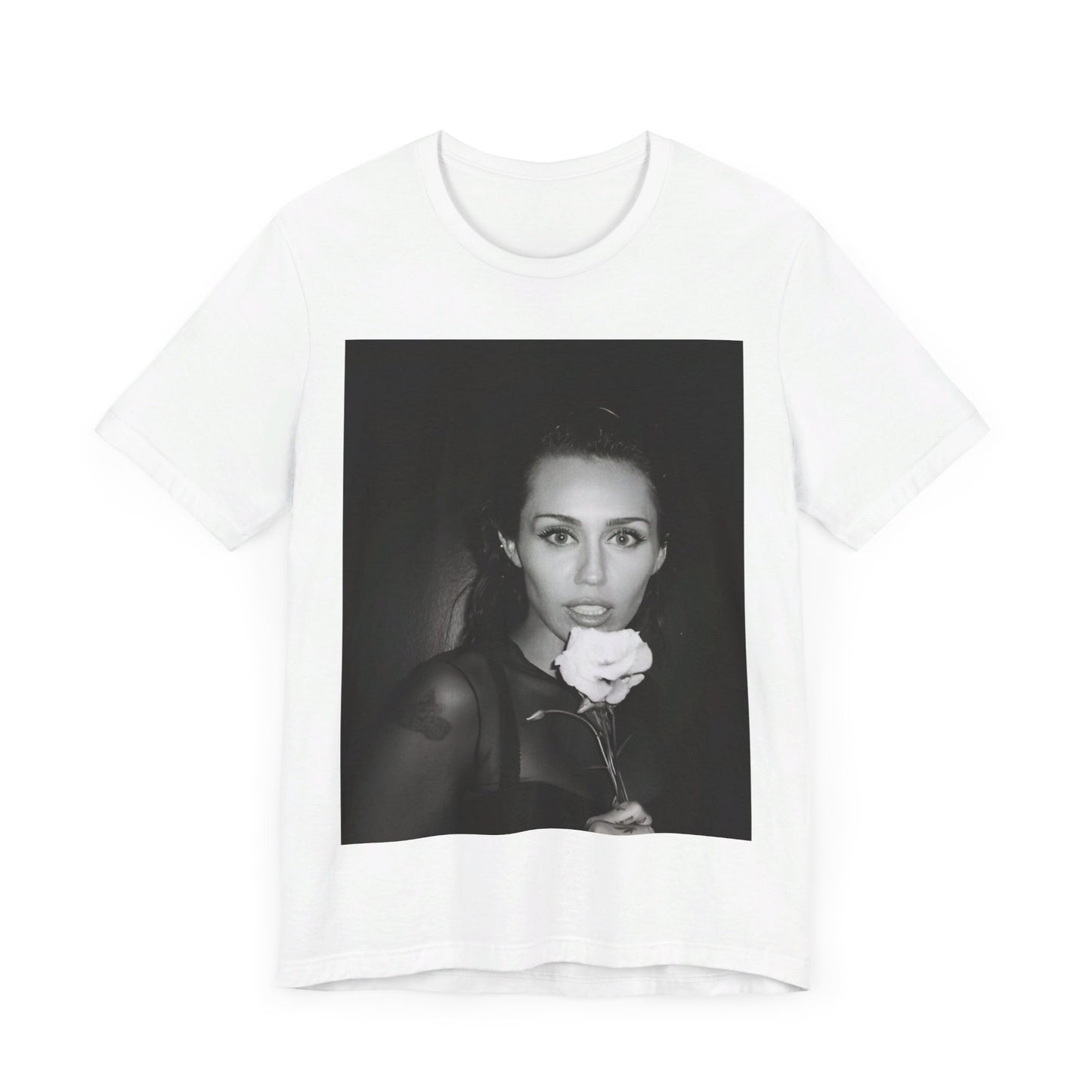 A black graphic t-shirt featuring a graphic related to Miley Cyrus' 'Flowers' song or era.