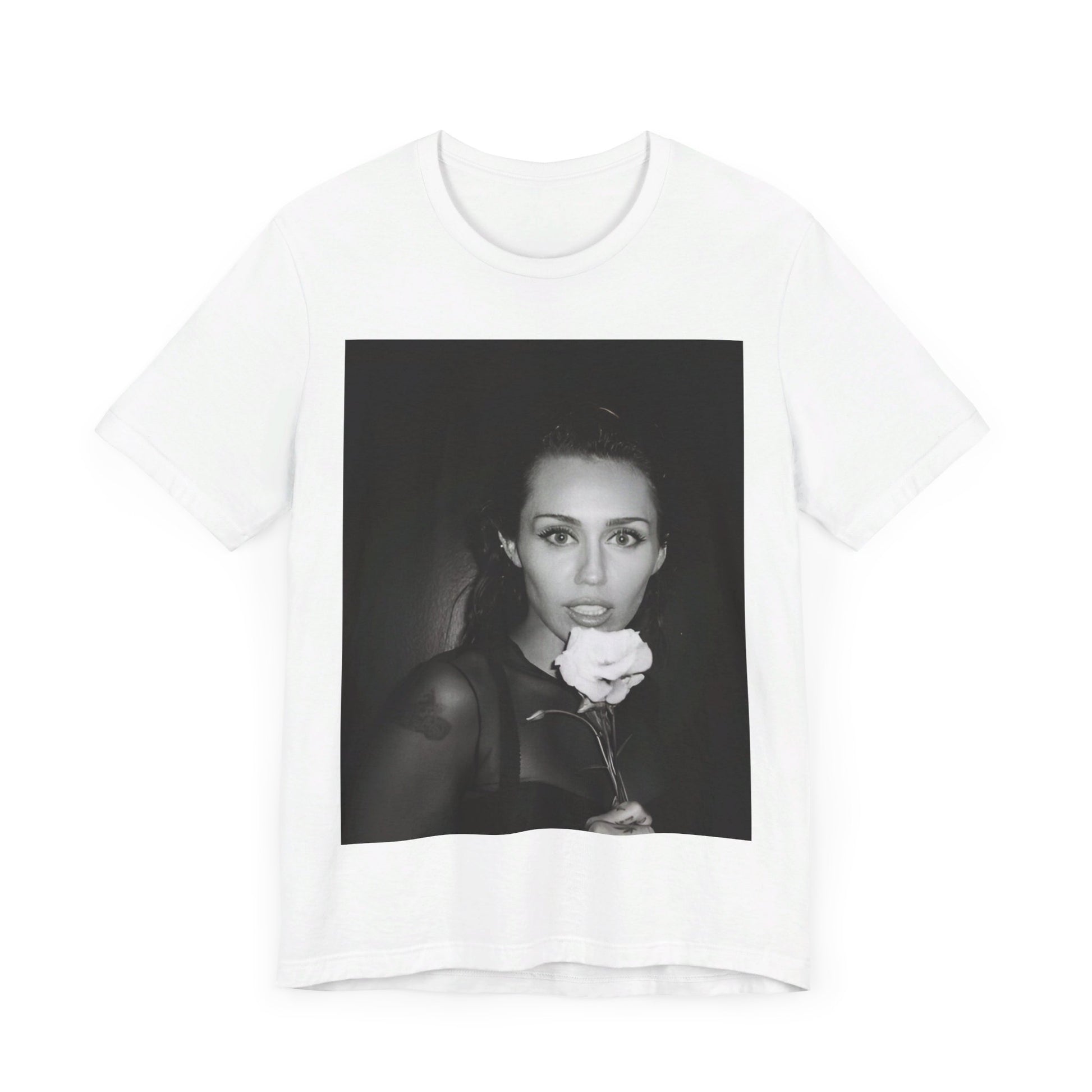 A black graphic t-shirt featuring a graphic related to Miley Cyrus' 'Flowers' song or era.