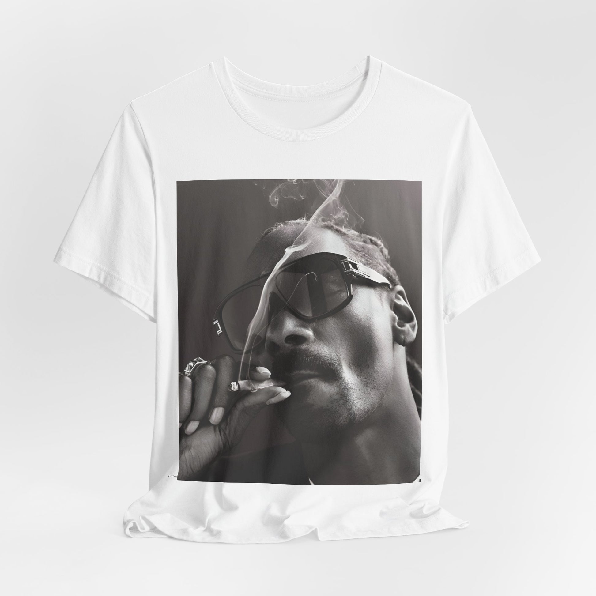 A black graphic t-shirt featuring an iconic black and white shaded portrait graphic of Snoop Dogg.