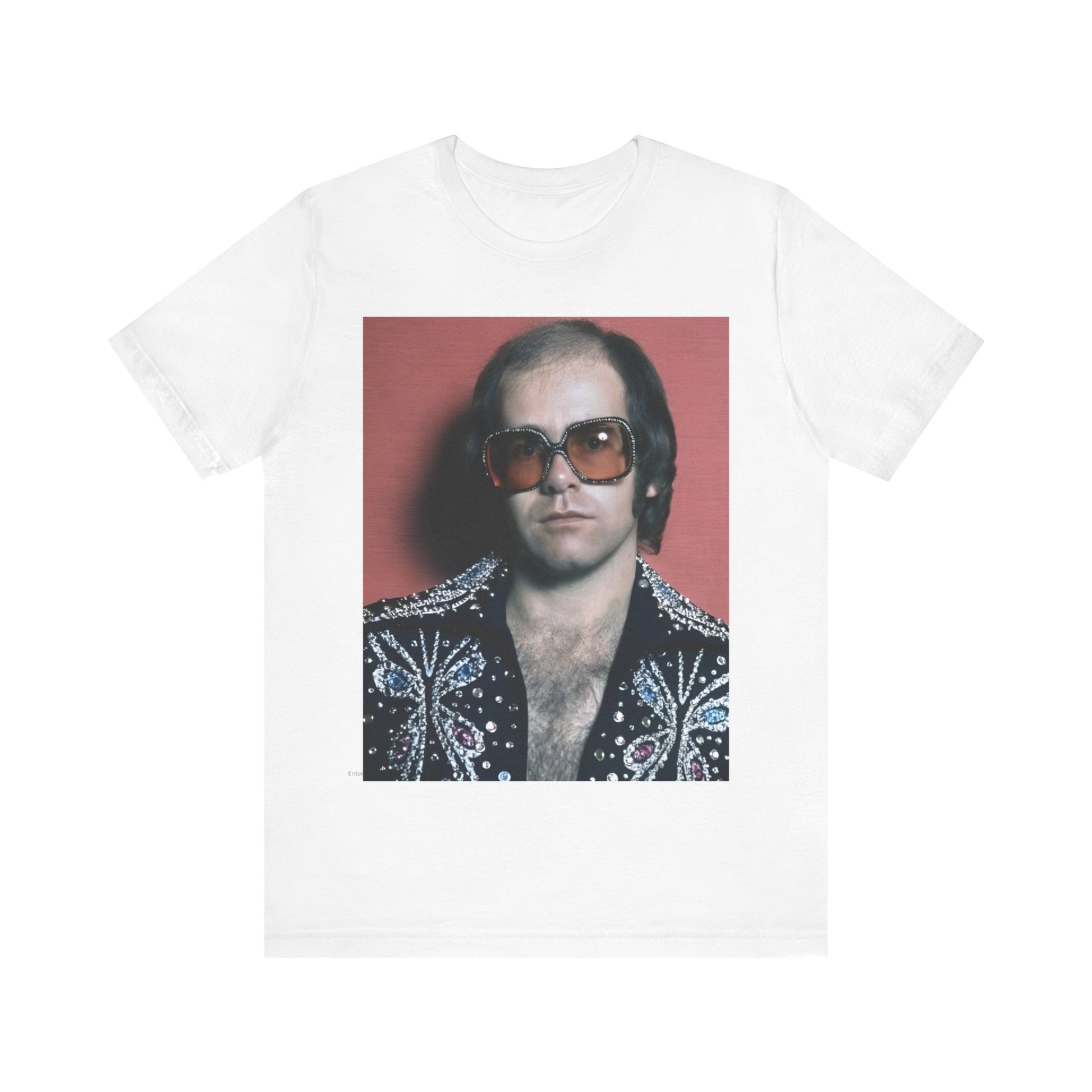 A black graphic t-shirt featuring a vintage glam rock icon graphic of Elton John.