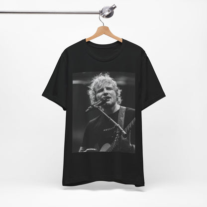 A black graphic t-shirt featuring a black and white photo of Ed Sheeran performing live.