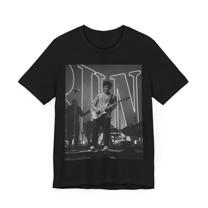 A black graphic t-shirt featuring a black and white photo of Bruno Mars performing live on stage.