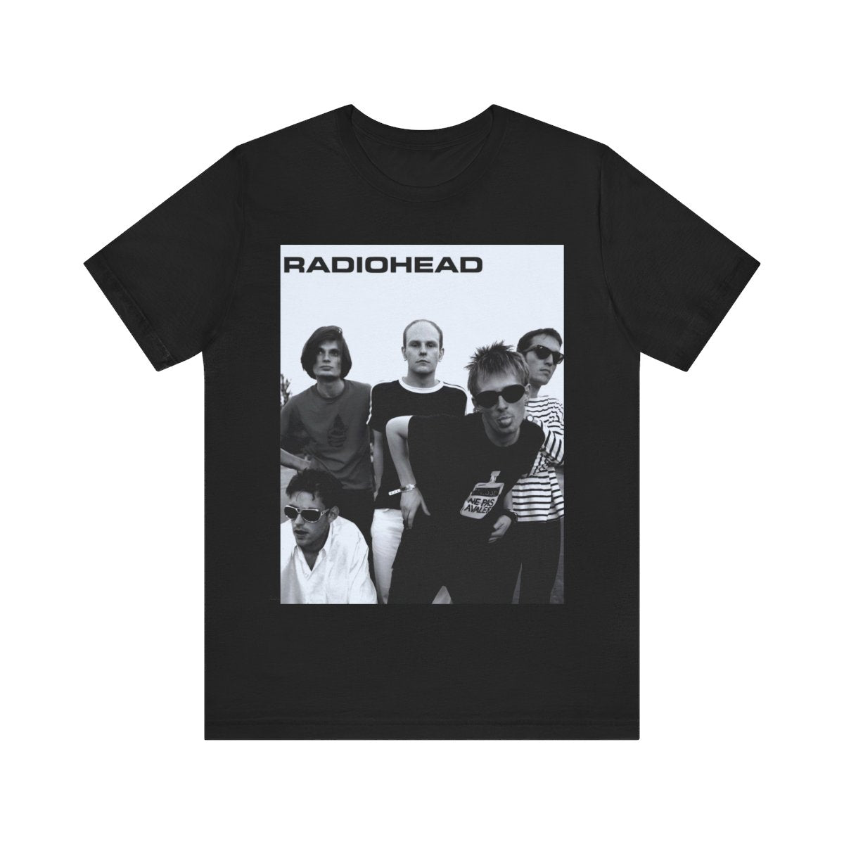 A black graphic t-shirt featuring a vintage 90s graphic related to Radiohead's 'Creep' song or era.