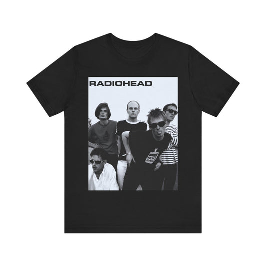 A black graphic t-shirt featuring a vintage 90s graphic related to Radiohead's 'Creep' song or era.