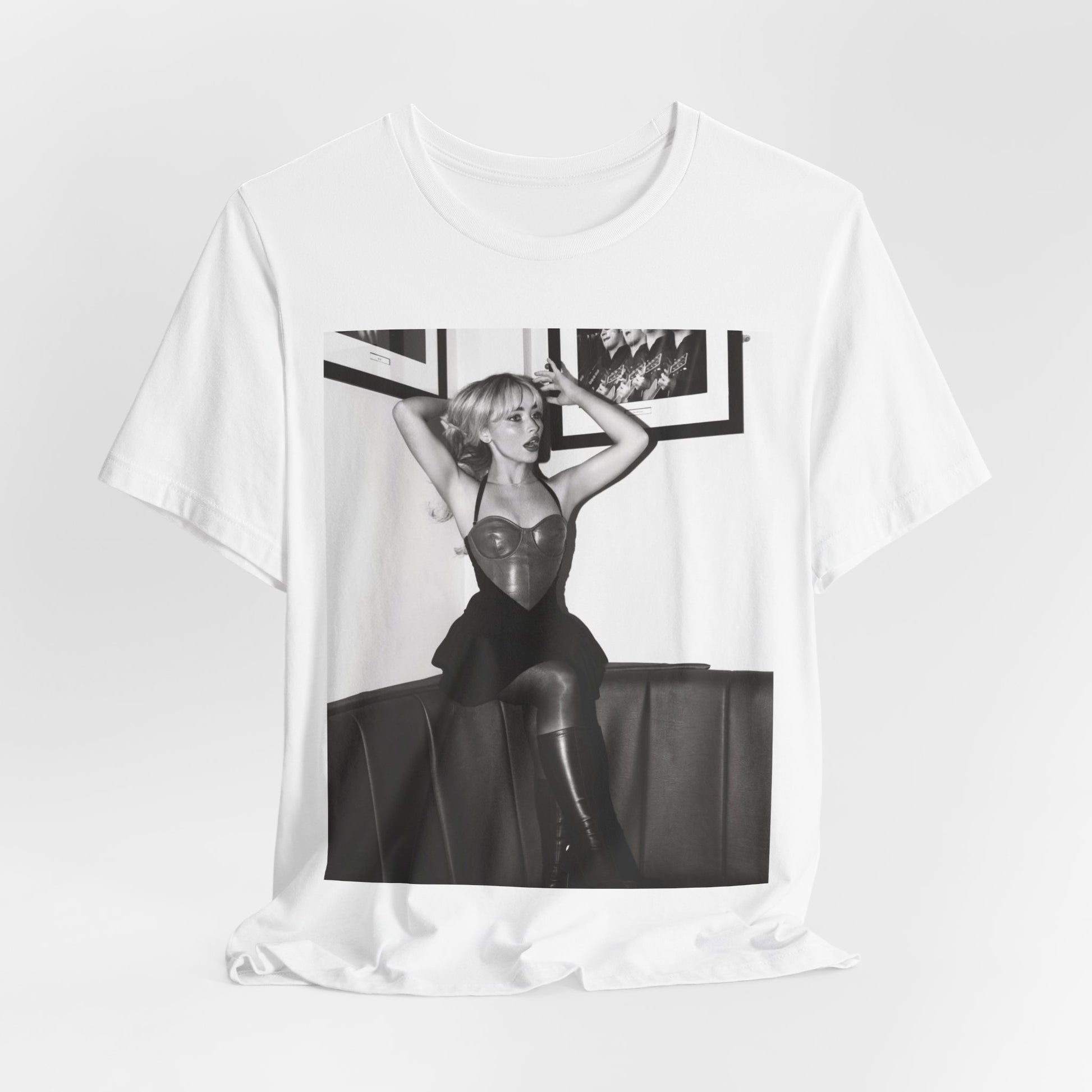 A black graphic t-shirt featuring a black and white graphic of Sabrina Carpenter as a pop princess.