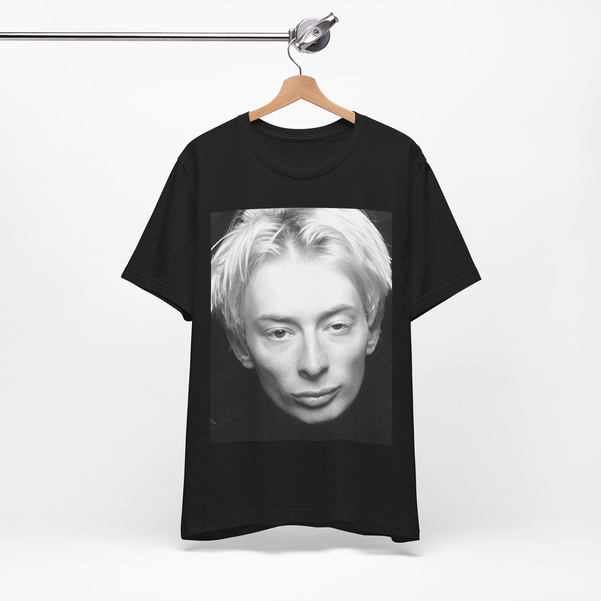 A black graphic t-shirt featuring a 90s black and white portrait photo of Thom Yorke from Radiohead.