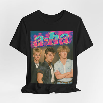 A black graphic t-shirt featuring a retro 80s-style band graphic for A-HA, possibly with band members in a stylized design.