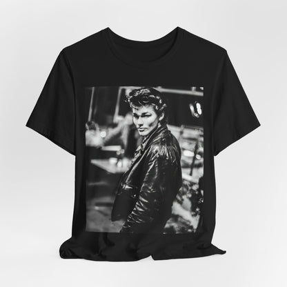 A black graphic t-shirt featuring a retro 80s tour graphic for the band A-HA, possibly showing concert elements or band members in a stylized design.