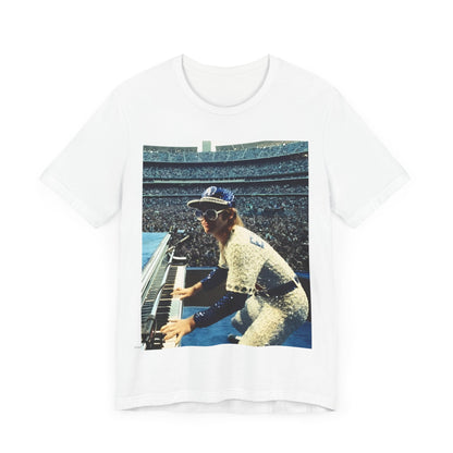 A black graphic t-shirt featuring a photo of Elton John from his 1975 Dodgers Stadium concert.