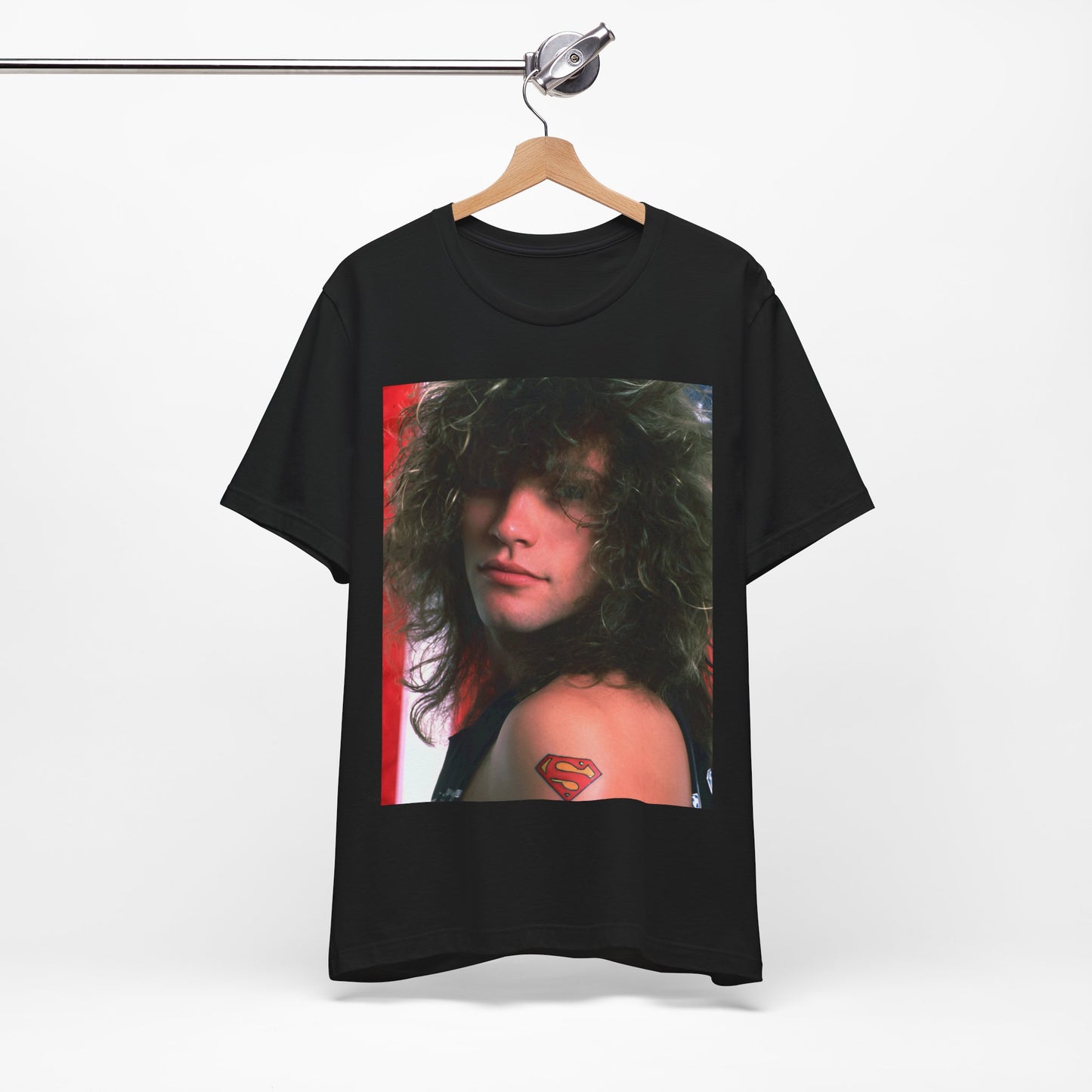 A black graphic t-shirt featuring a graphic of Bon Jovi, possibly with a Superman logo or a tattoo-inspired design.