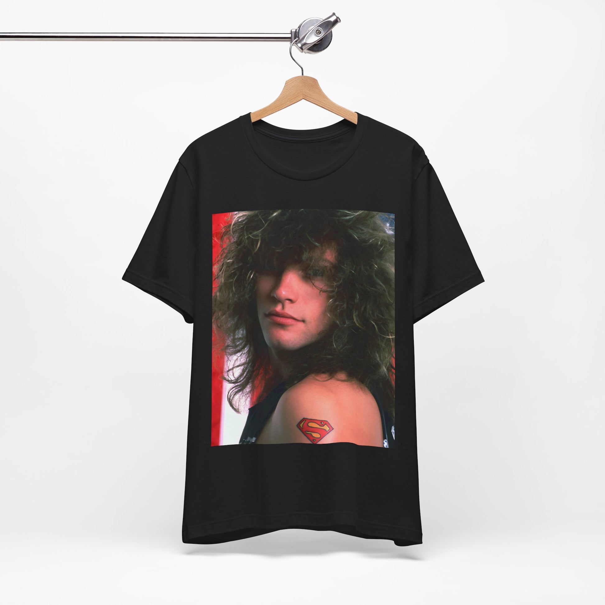 A black graphic t-shirt featuring a graphic of Bon Jovi, possibly with a Superman logo or a tattoo-inspired design.