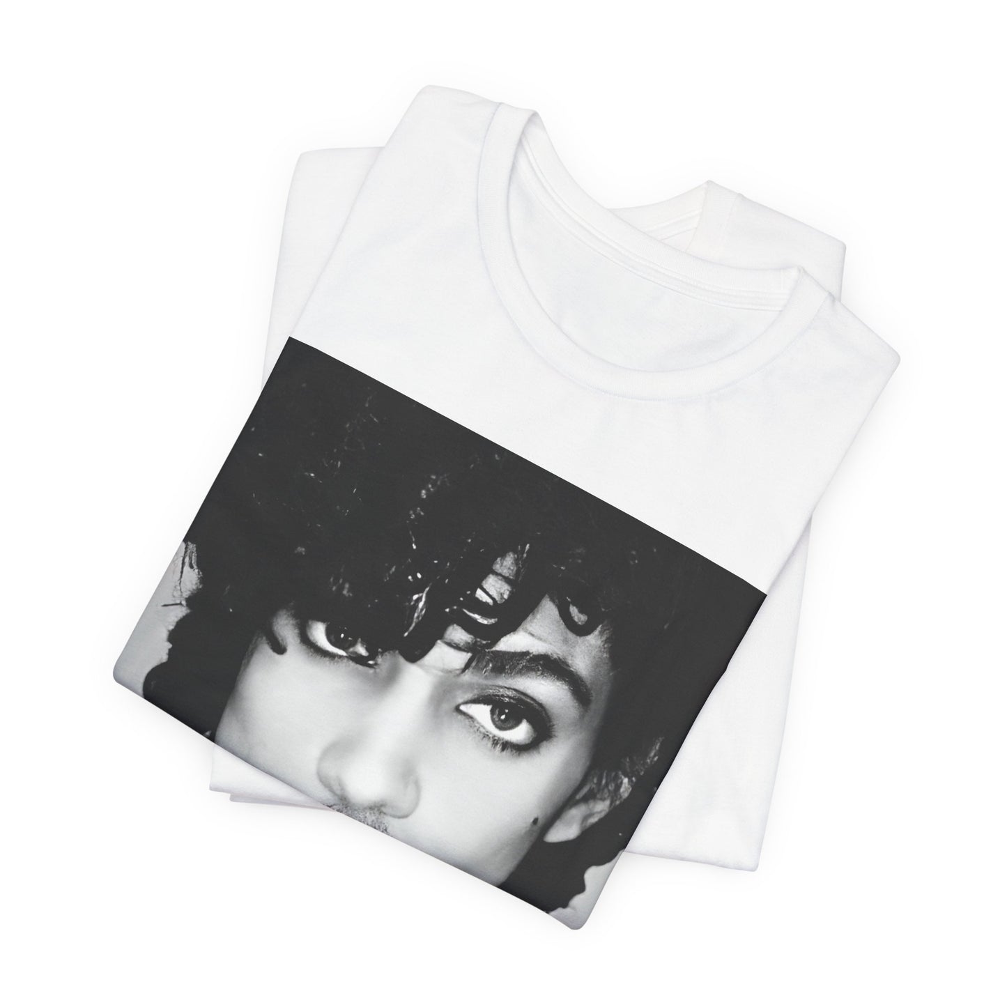 A black graphic t-shirt featuring a black and white photo portrait of Prince.